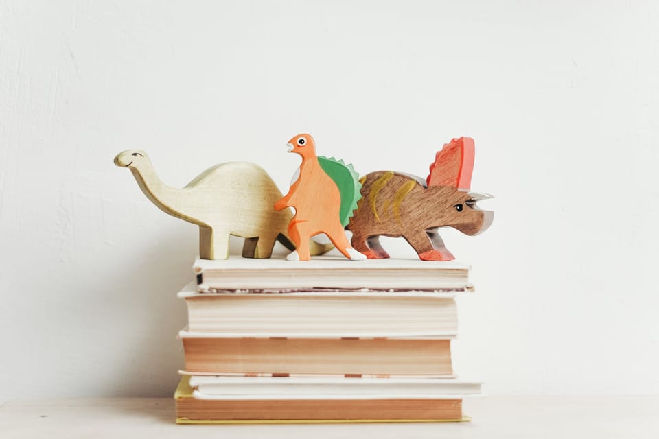 three wooden dinosaur